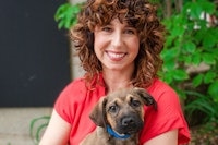 Dr. Annie Valuska, PhD holding her puppy